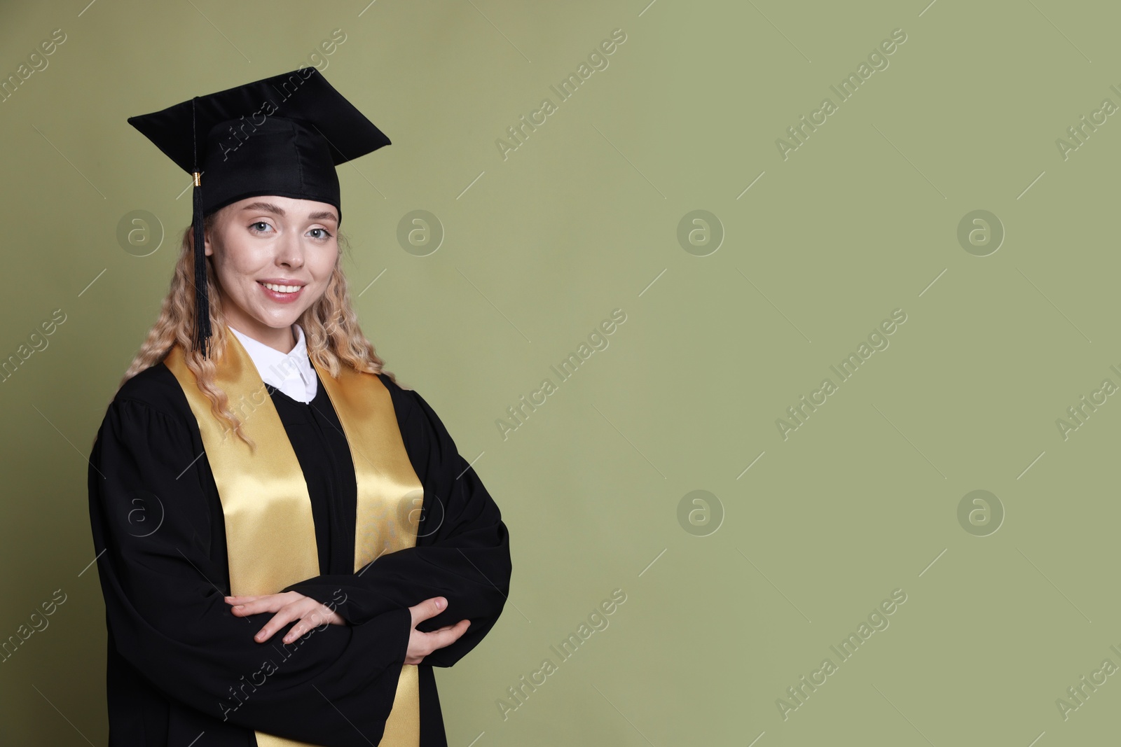 Happy student after graduation on green background. Space for text Photo of Happy student after graduation on green background. Space for text