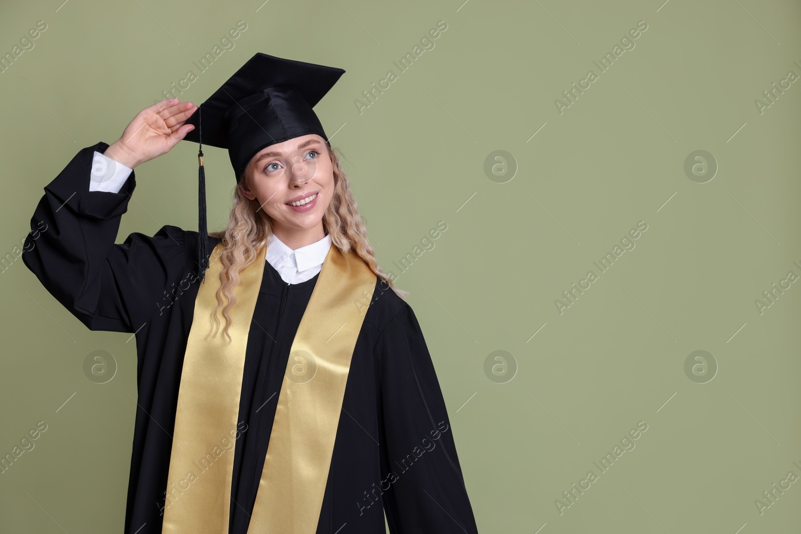 Happy student after graduation on green background. Space for text Photo of Happy student after graduation on green background. Space for text