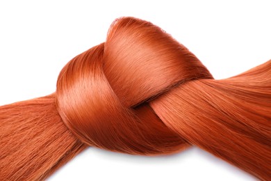 Image of Beautiful strand of red hair tied in knot on white background, top view