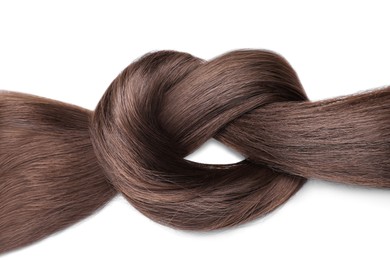 Image of Beautiful strand of dark brown hair tied in knot on white background, top view