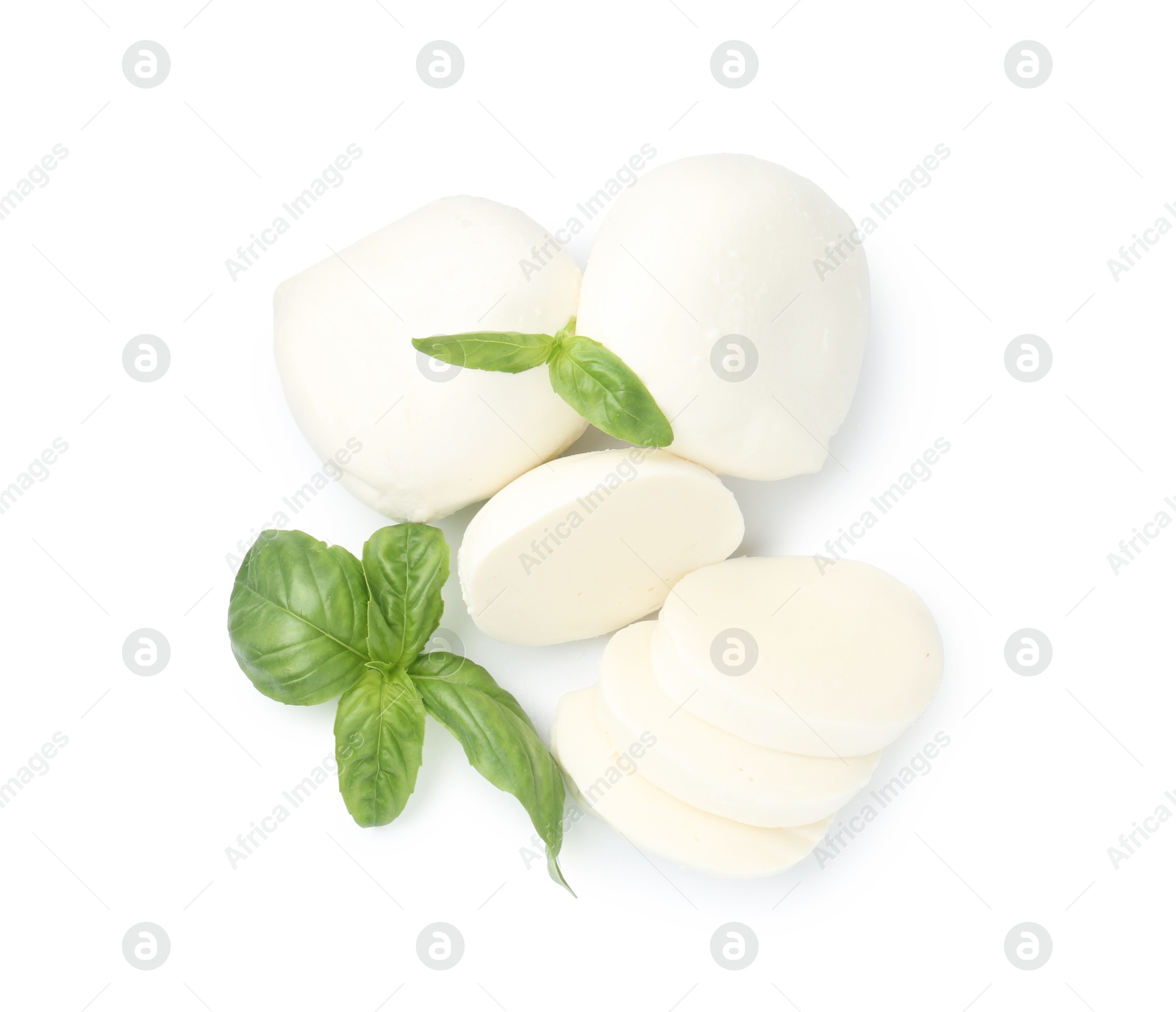Pieces of mozzarella cheese and basil isolated on white, top view Photo of Pieces of mozzarella cheese and basil isolated on white, top view