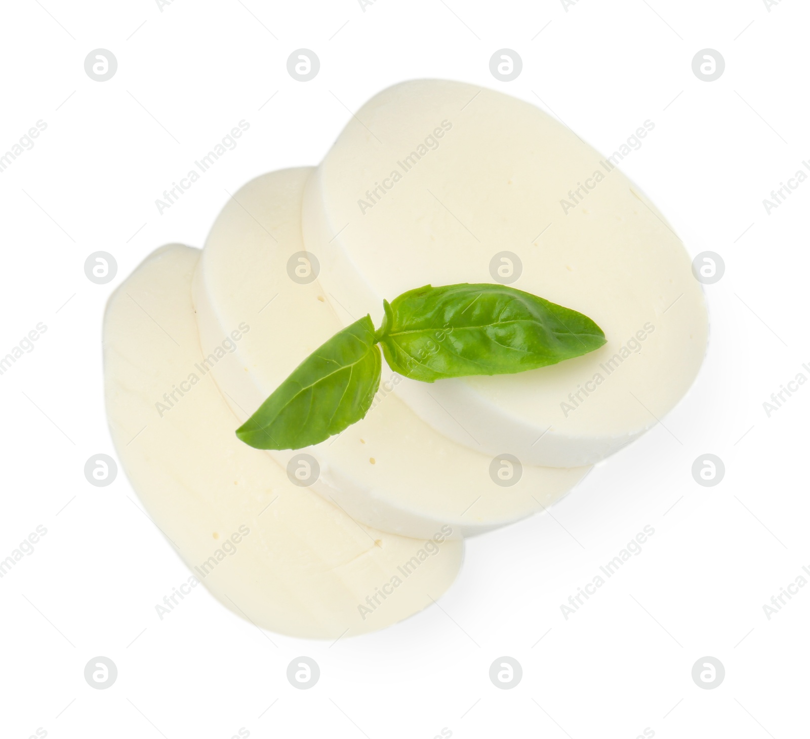 Pieces of mozzarella cheese and basil isolated on white, top view Photo of Pieces of mozzarella cheese and basil isolated on white, top view