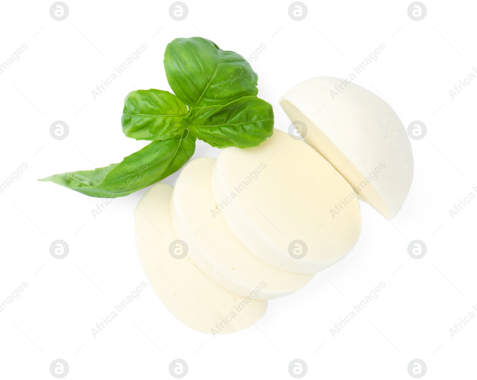 Pieces of mozzarella cheese and basil isolated on white, top view Photo of Pieces of mozzarella cheese and basil isolated on white, top view