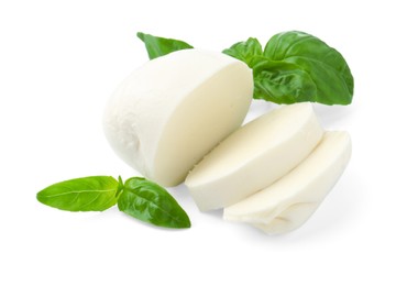 Photo of Pieces of mozzarella cheese and basil isolated on white