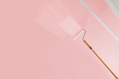 Image of Painting ceiling with pink dye indoors, low angle view