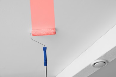 Image of Painting ceiling with pink dye indoors, low angle view