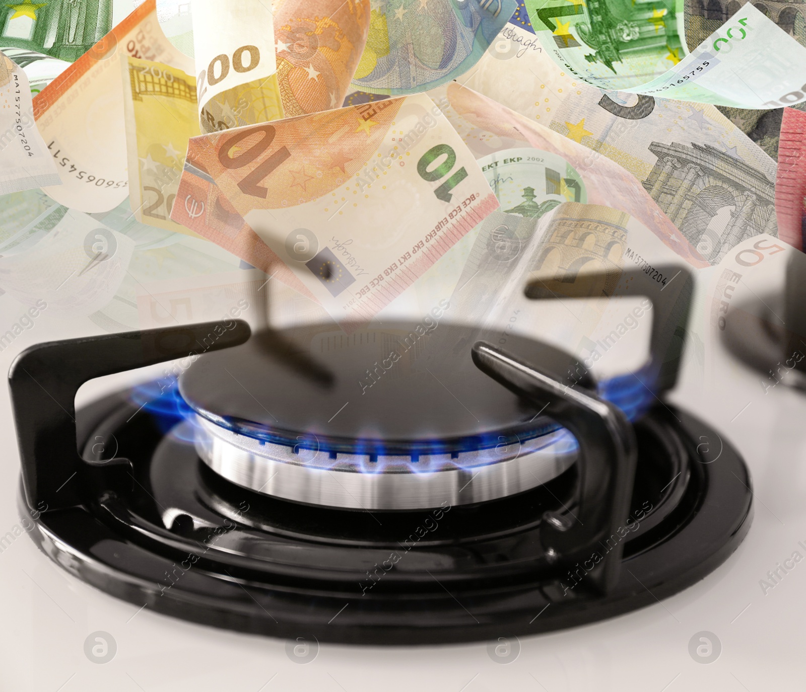 Gas burner with blue flame and euro bills, double exposure. Gas tariff Image of Gas burner with blue flame and euro bills, double exposure. Gas tariff