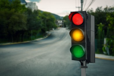 Image of Traffic lights on empty road. Signaling device