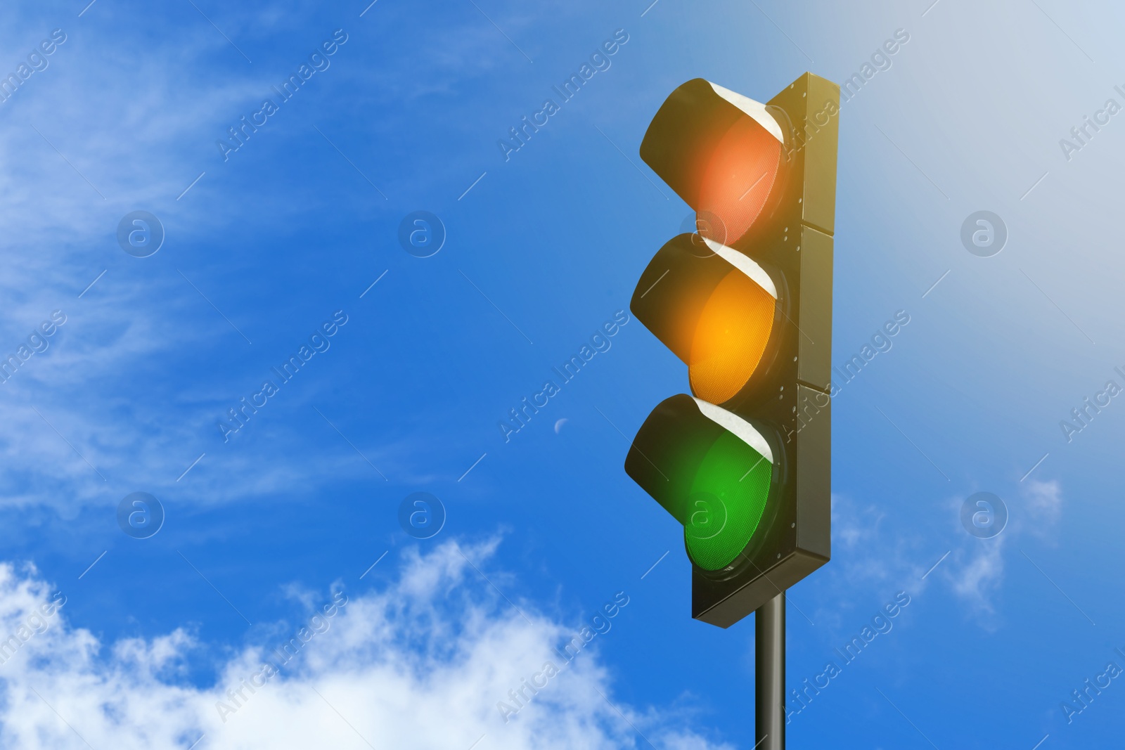 Traffic lights against blue sky with clouds Image of Traffic lights against blue sky with clouds