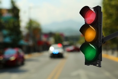 Image of Traffic lights on city road. Signaling device