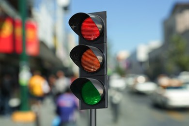 Image of Traffic lights on city road. Signaling device