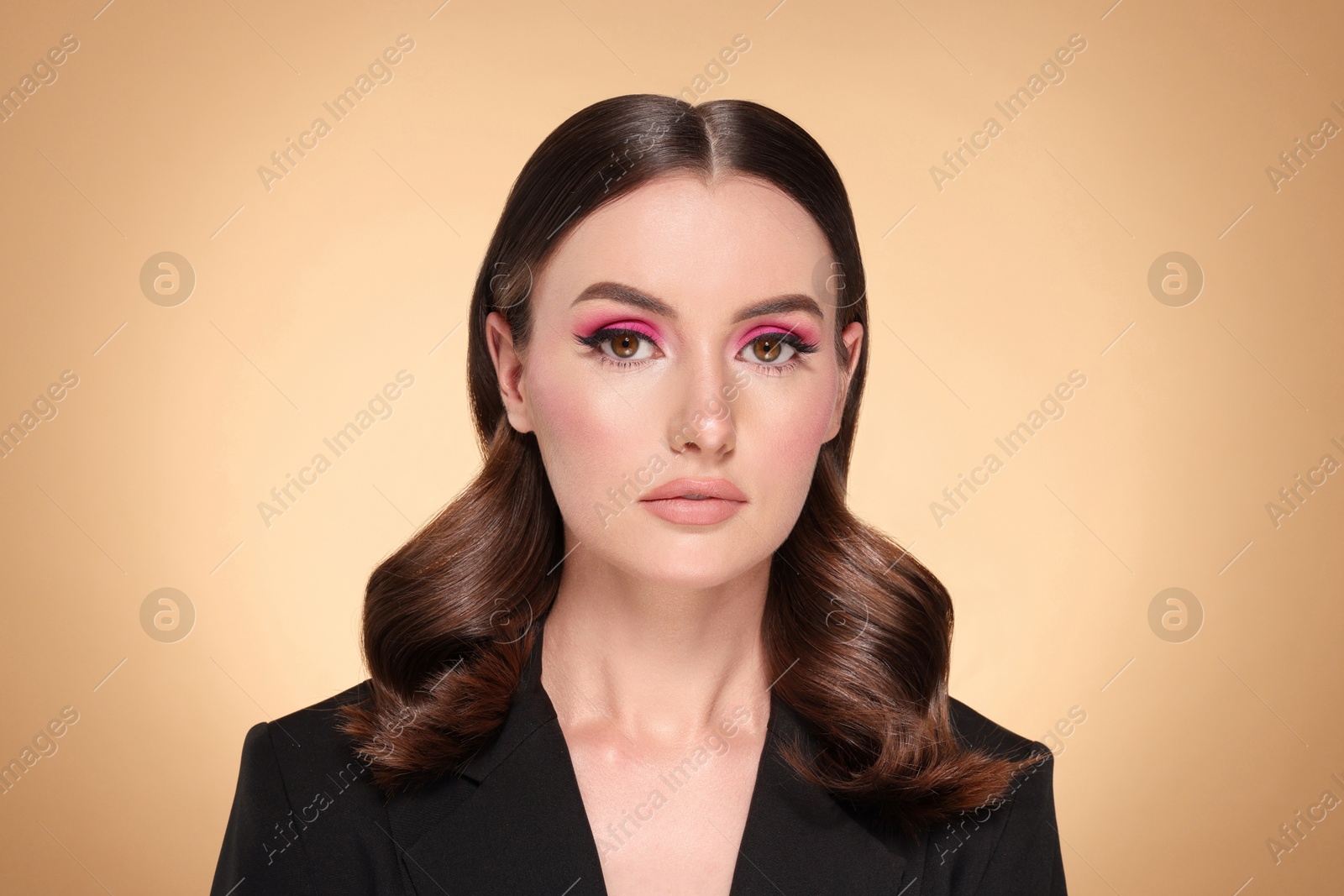 Beautiful young woman with shiny healthy hair on dark beige background Image of Beautiful young woman with shiny healthy hair on dark beige background