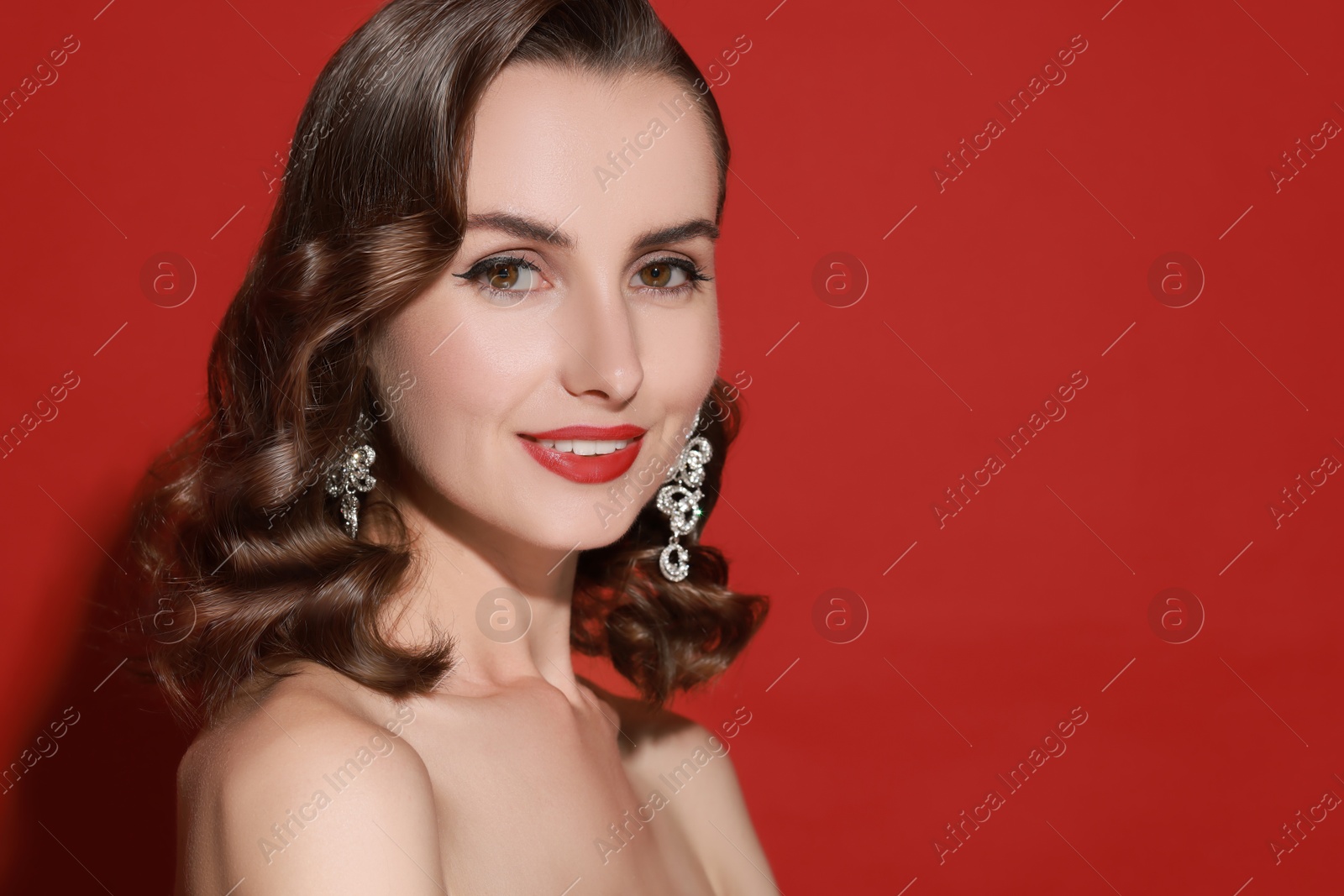 Attractive woman with shiny healthy hair on red background Image of Attractive woman with shiny healthy hair on red background