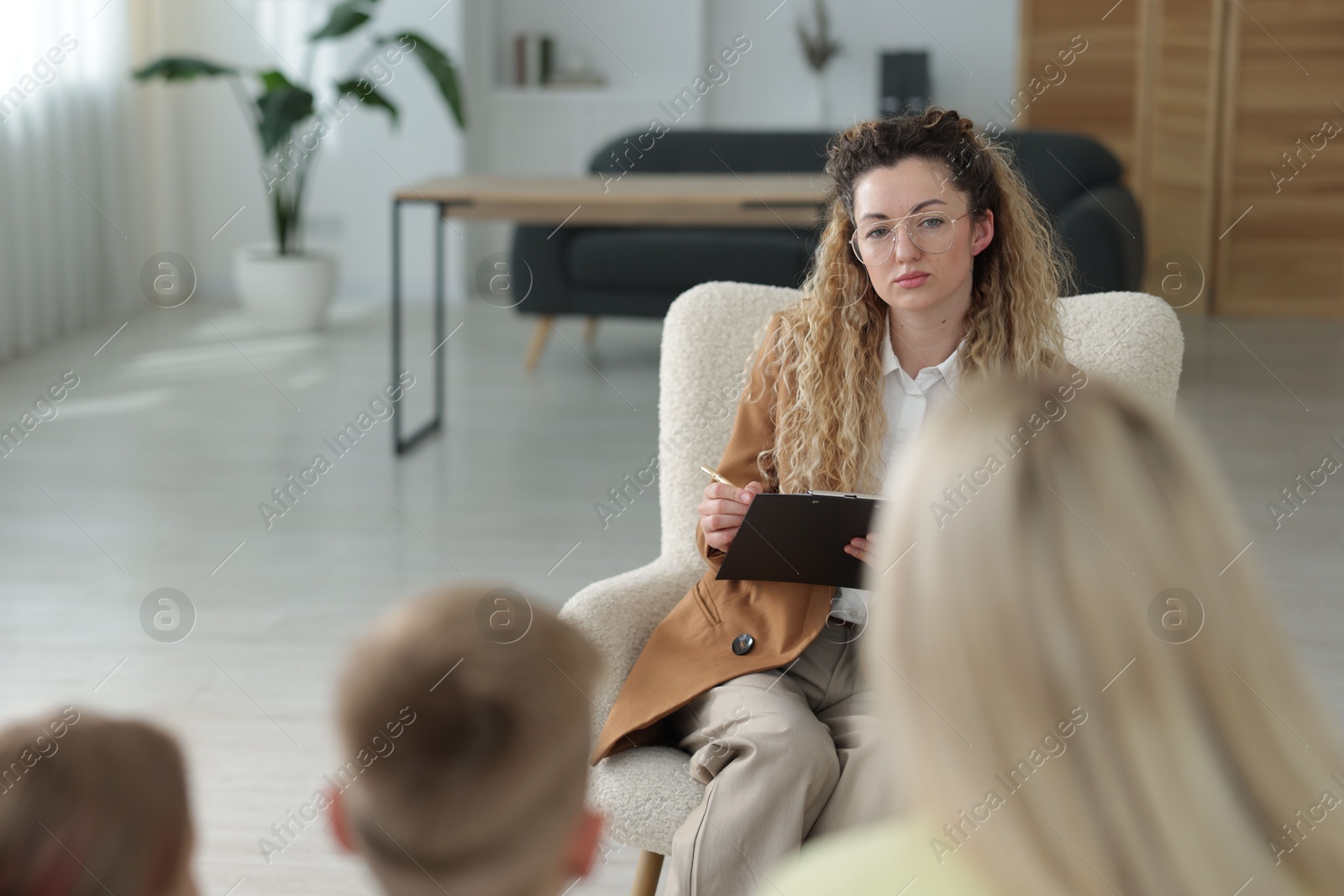 Family having consultation with psychologist in office, selective focus Photo of Family having consultation with psychologist in office, selective focus
