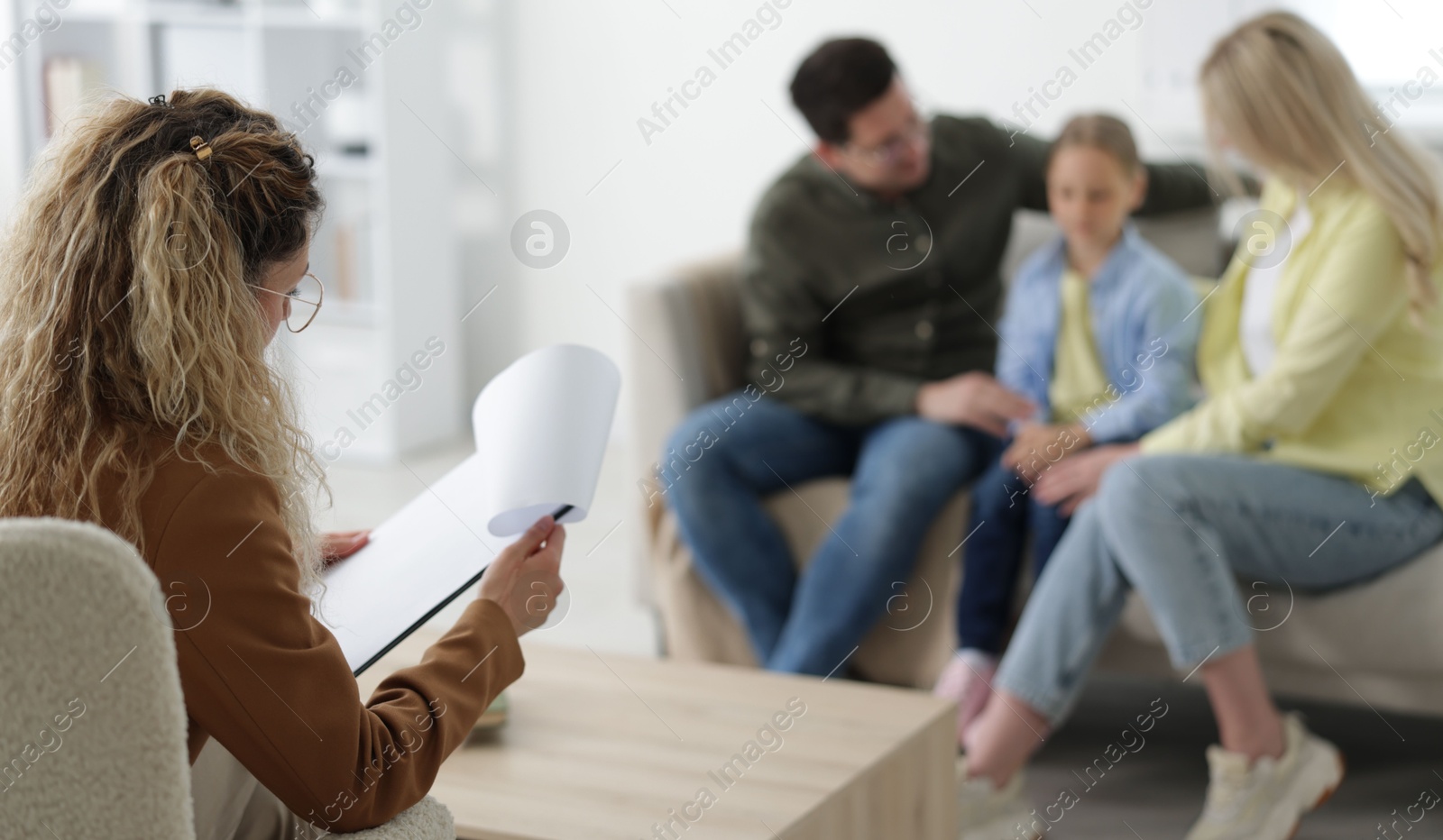 Family having consultation with psychologist in office, selective focus Photo of Family having consultation with psychologist in office, selective focus