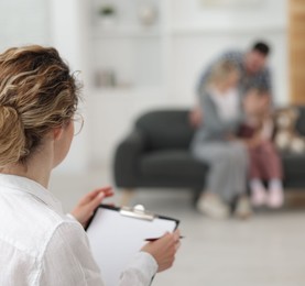 Photo of Family psychologist during consultation in office, selective focus
