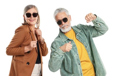 Photo of Senior couple in stylish outfits on white background