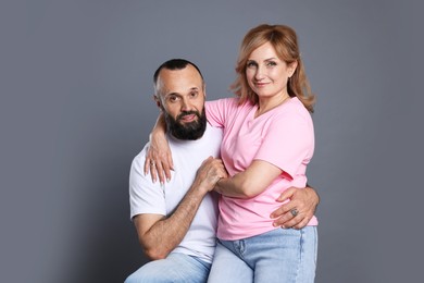 Photo of Portrait of lovely couple on grey background