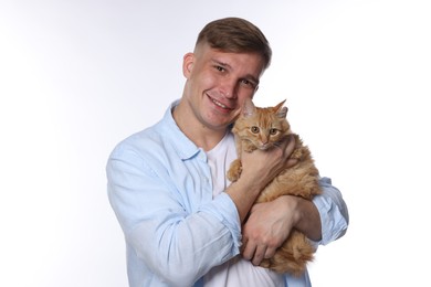 Photo of Man with cute ginger cat on white background