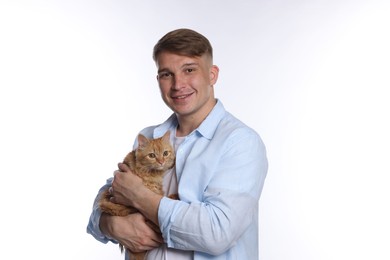 Photo of Man with cute ginger cat on white background
