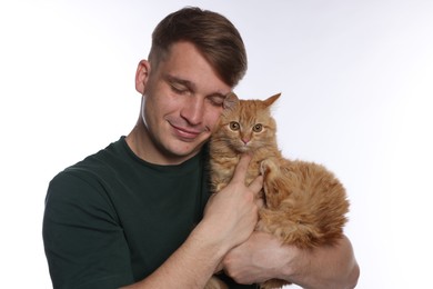 Photo of Man with cute ginger cat on white background