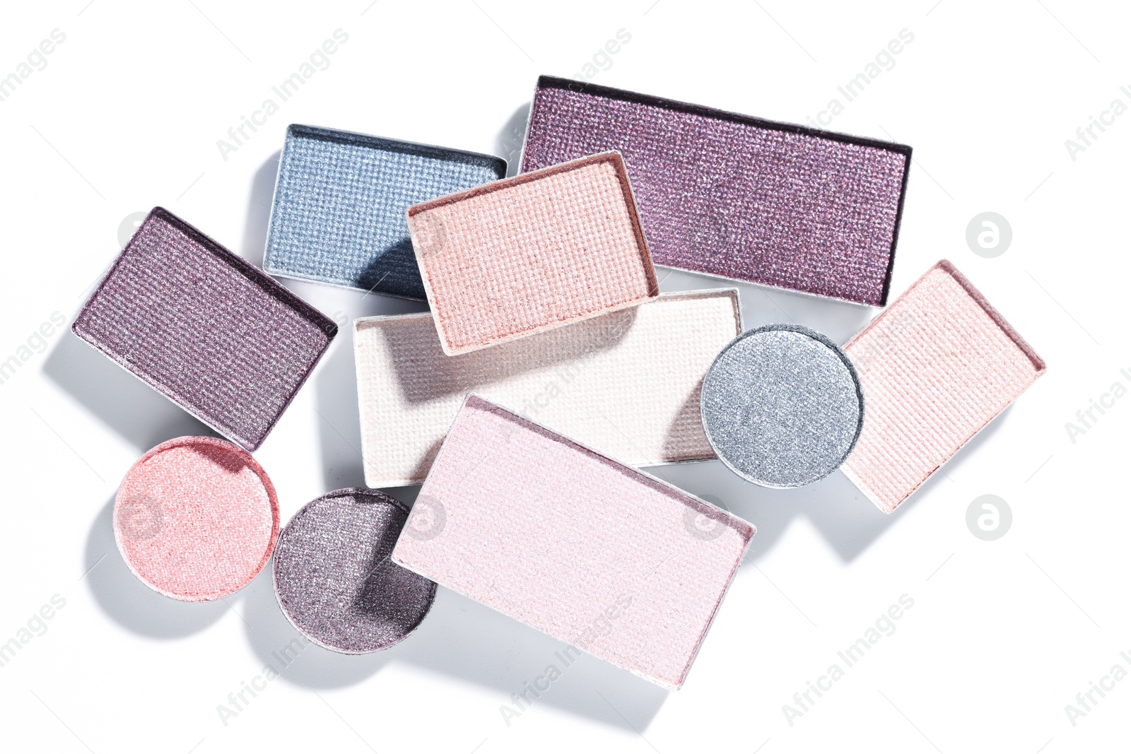 Beautiful eyeshadow refill pans on white background, flat lay Photo of Beautiful eyeshadow refill pans on white background, flat lay