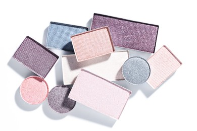 Photo of Beautiful eyeshadow refill pans on white background, flat lay