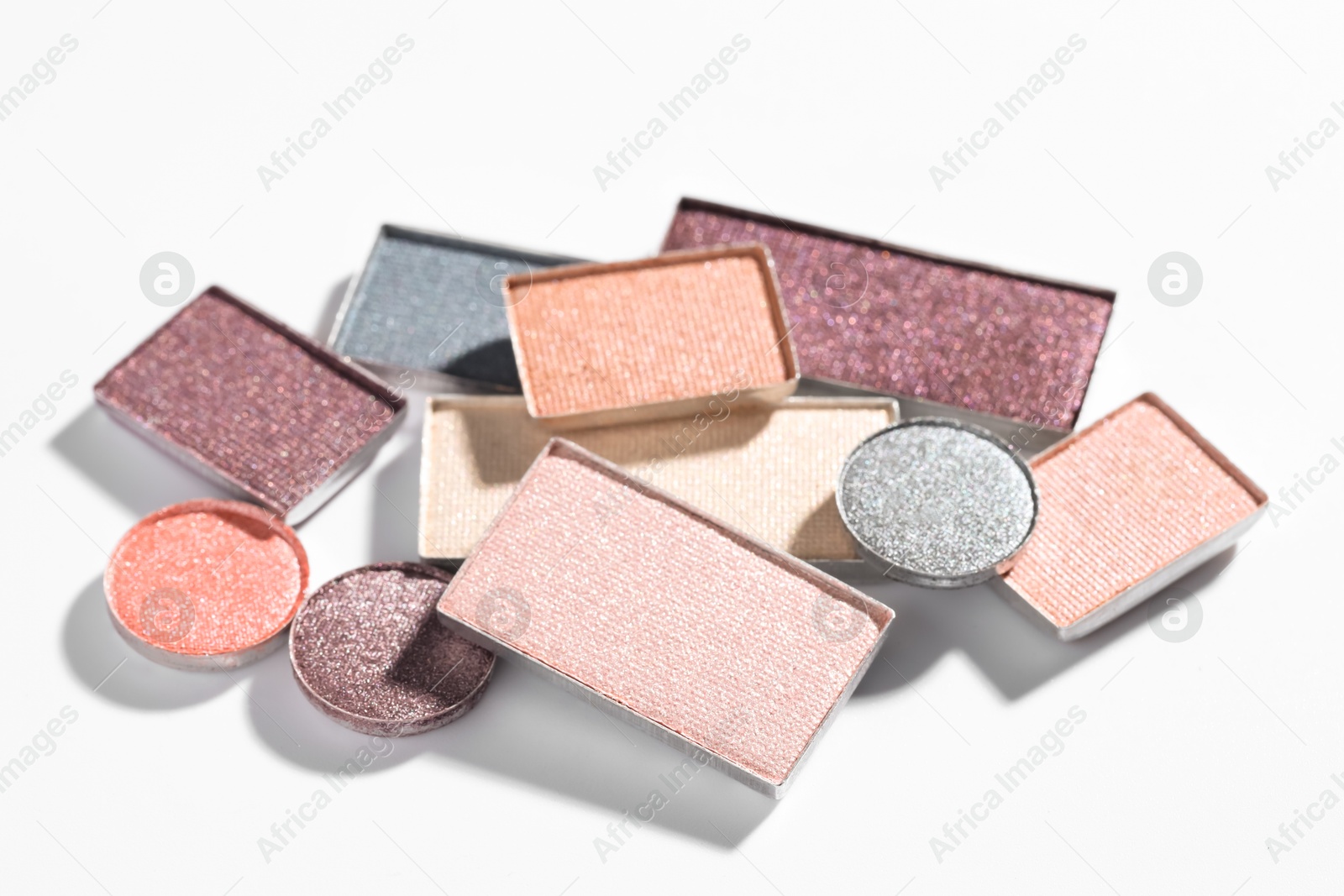Beautiful eyeshadow refill pans on white background Photo of Beautiful eyeshadow refill pans on white background