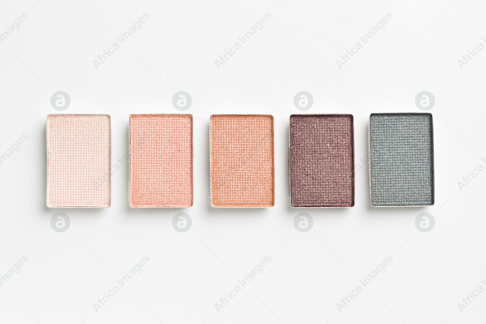Beautiful eyeshadow refill pans on white background, flat lay Photo of Beautiful eyeshadow refill pans on white background, flat lay