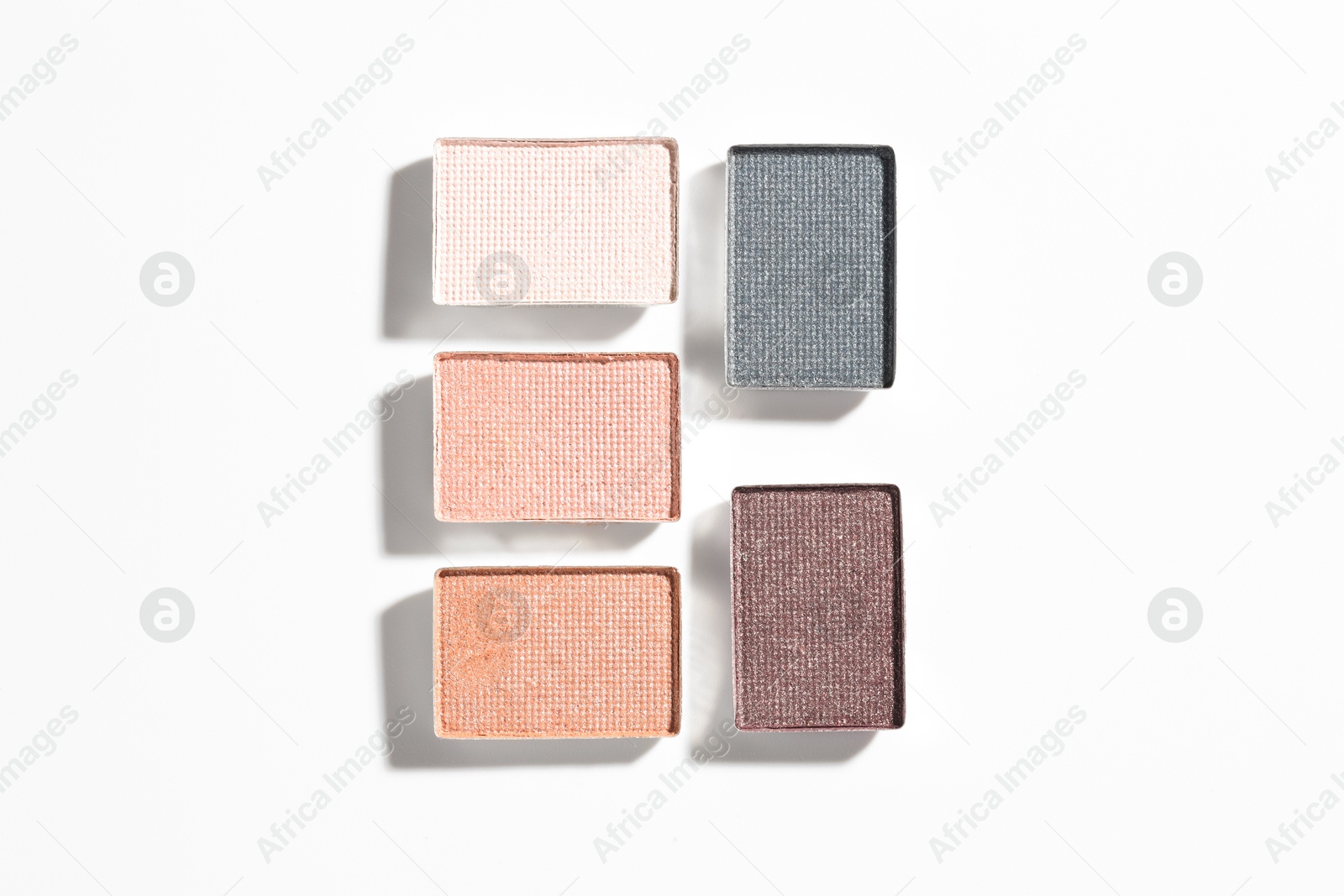Beautiful eyeshadow refill pans on white background, flat lay Photo of Beautiful eyeshadow refill pans on white background, flat lay