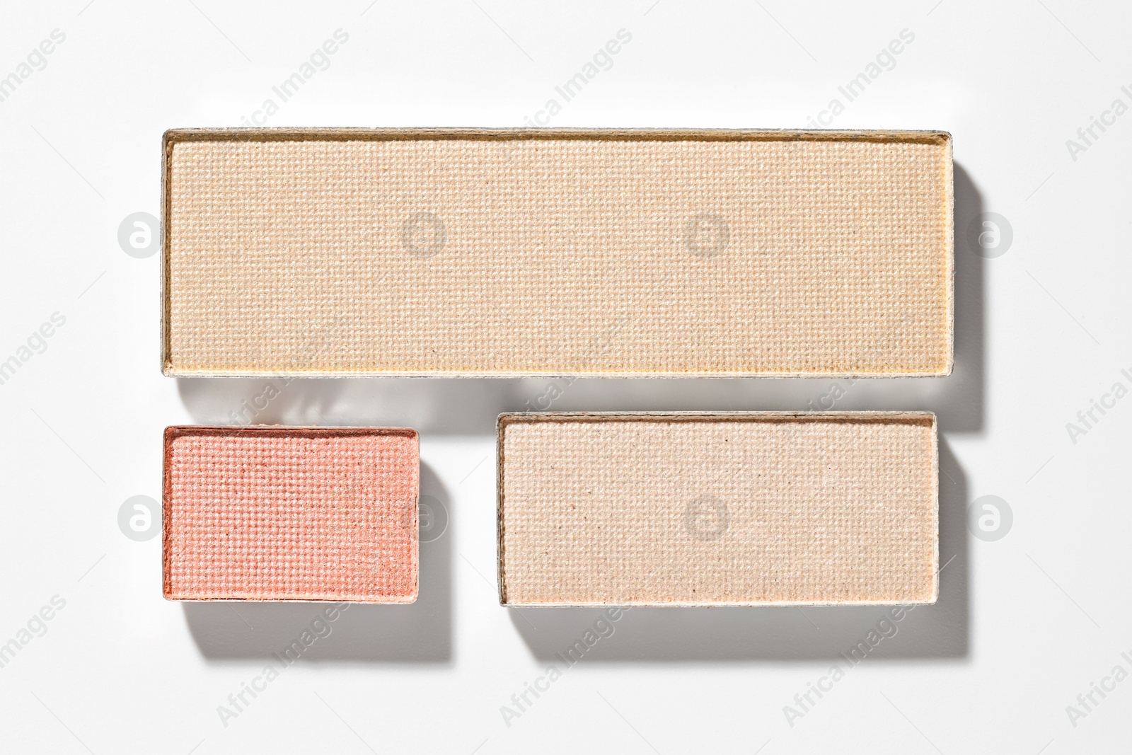 Beautiful eyeshadow refill pans on white background, flat lay Photo of Beautiful eyeshadow refill pans on white background, flat lay