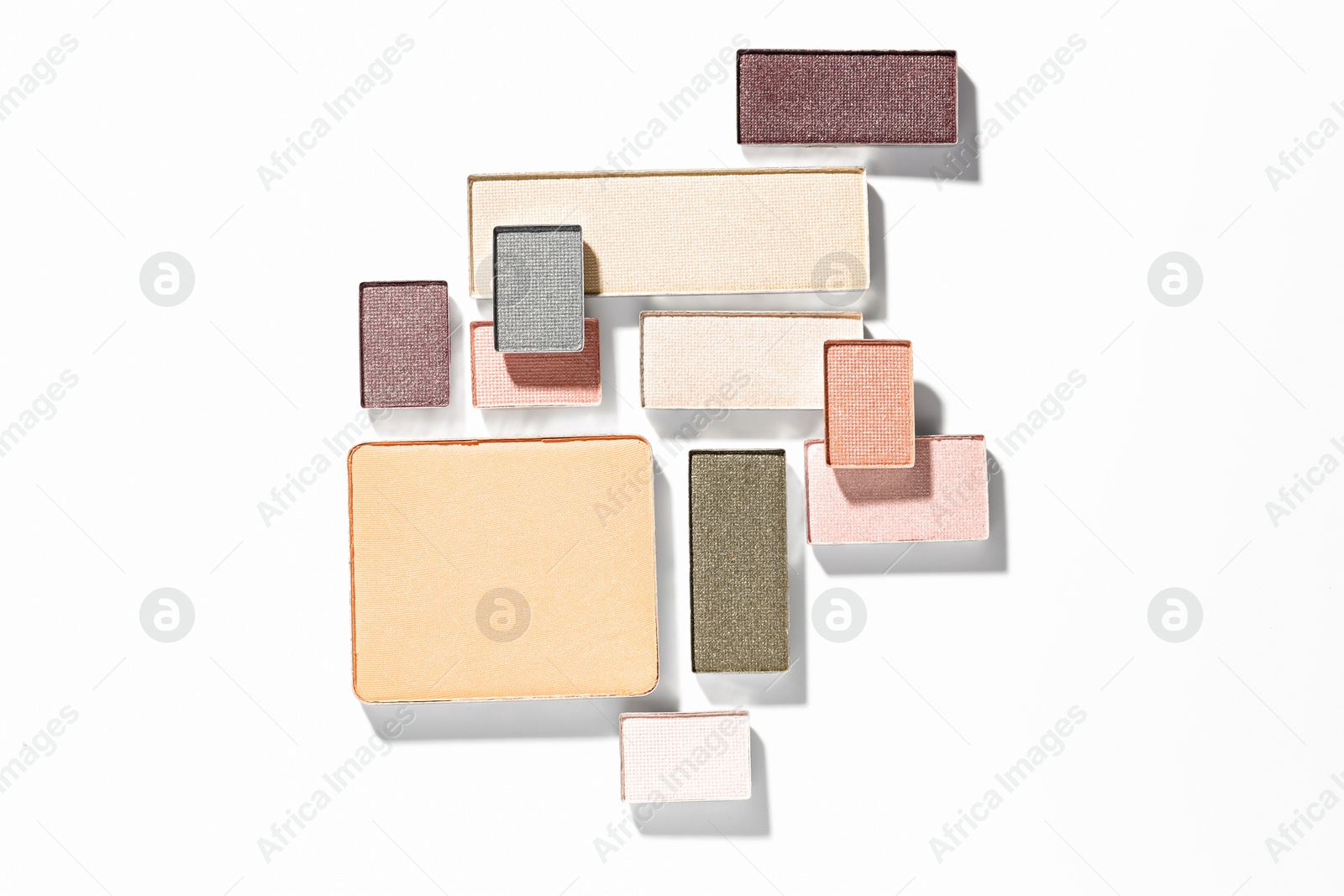 Beautiful eyeshadow refill pans on white background, flat lay Photo of Beautiful eyeshadow refill pans on white background, flat lay