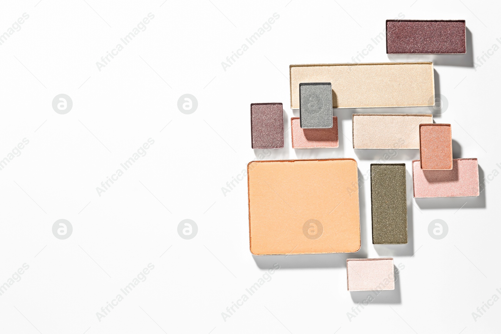 Beautiful eyeshadow refill pans on white background, flat lay. Space for text Photo of Beautiful eyeshadow refill pans on white background, flat lay. Space for text
