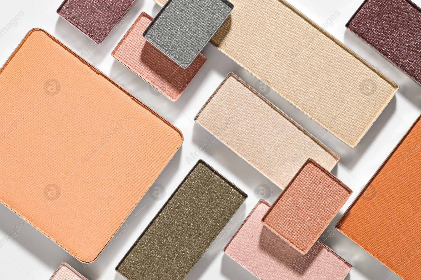 Beautiful eyeshadow refill pans on white background, flat lay Photo of Beautiful eyeshadow refill pans on white background, flat lay