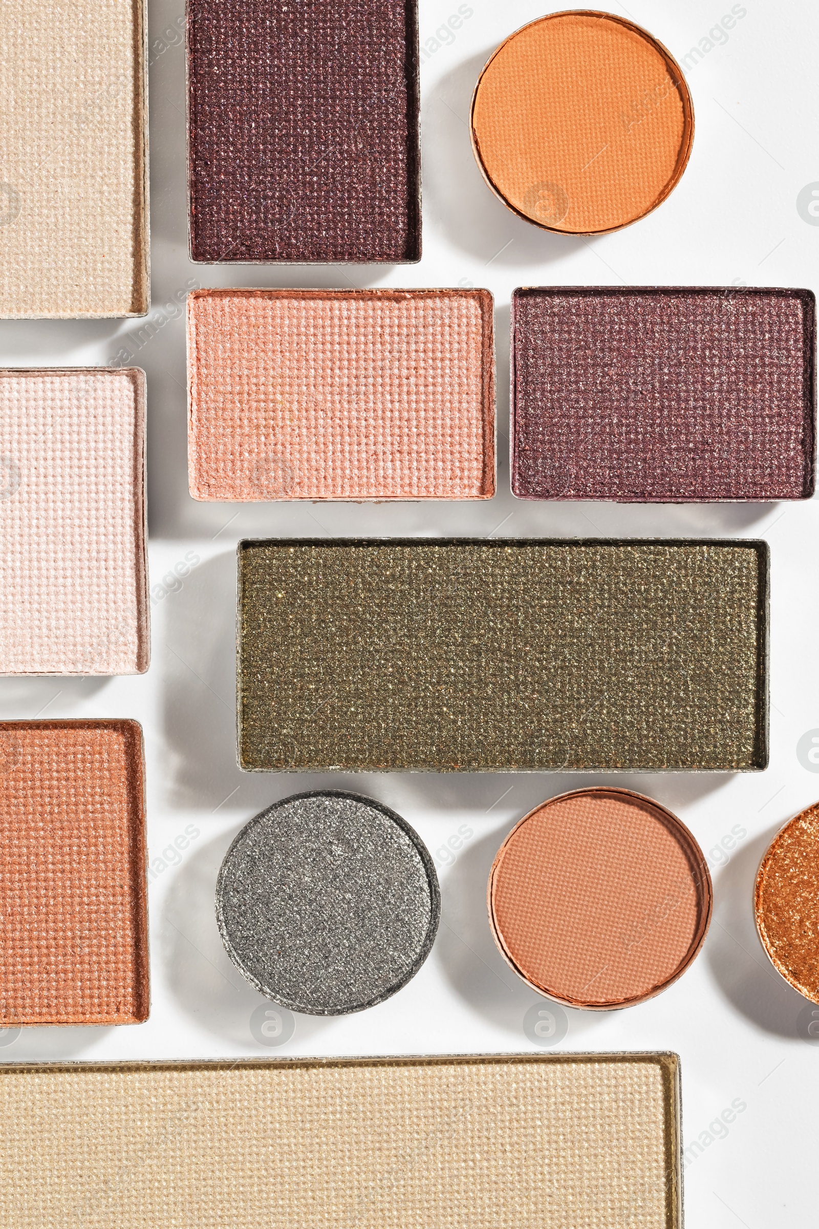 Beautiful eyeshadow refill pans on white background, flat lay Photo of Beautiful eyeshadow refill pans on white background, flat lay