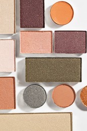 Photo of Beautiful eyeshadow refill pans on white background, flat lay