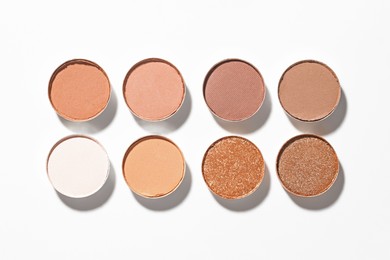 Photo of Beautiful eyeshadow refill pans on white background, flat lay