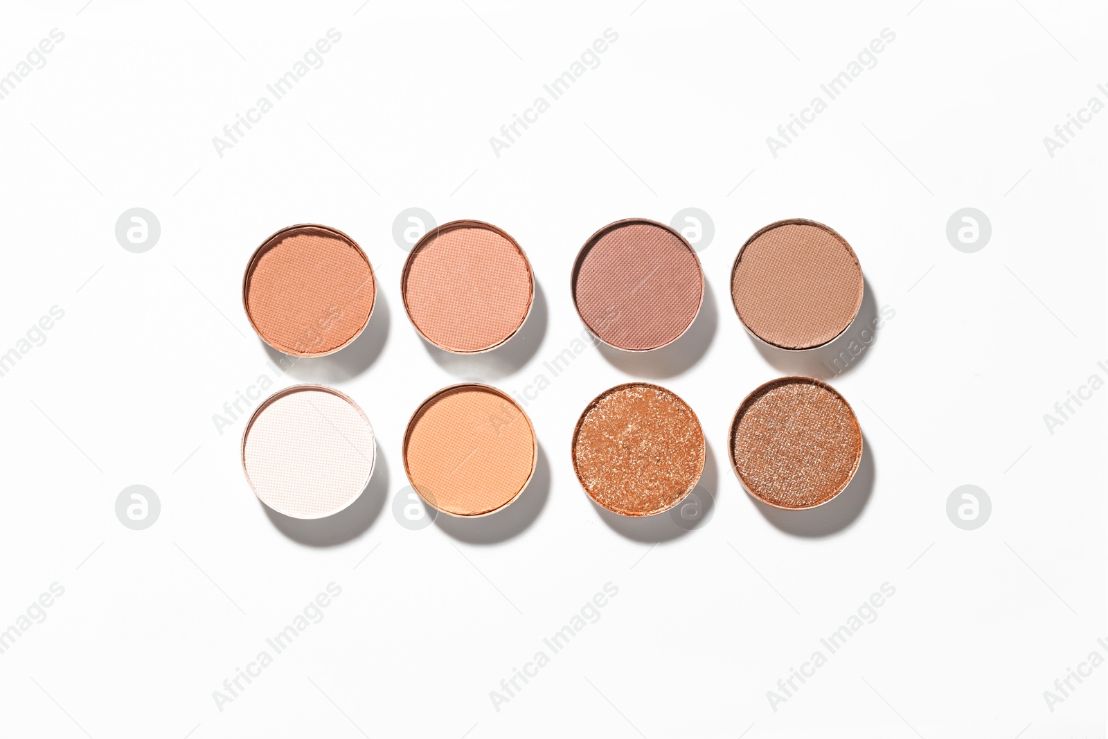 Beautiful eyeshadow refill pans on white background, flat lay Photo of Beautiful eyeshadow refill pans on white background, flat lay