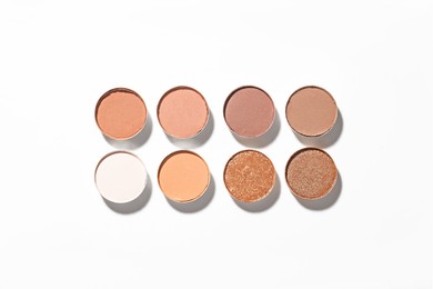 Photo of Beautiful eyeshadow refill pans on white background, flat lay
