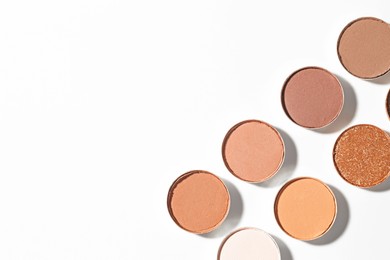 Photo of Beautiful eyeshadow refill pans on white background, flat lay. Space for text