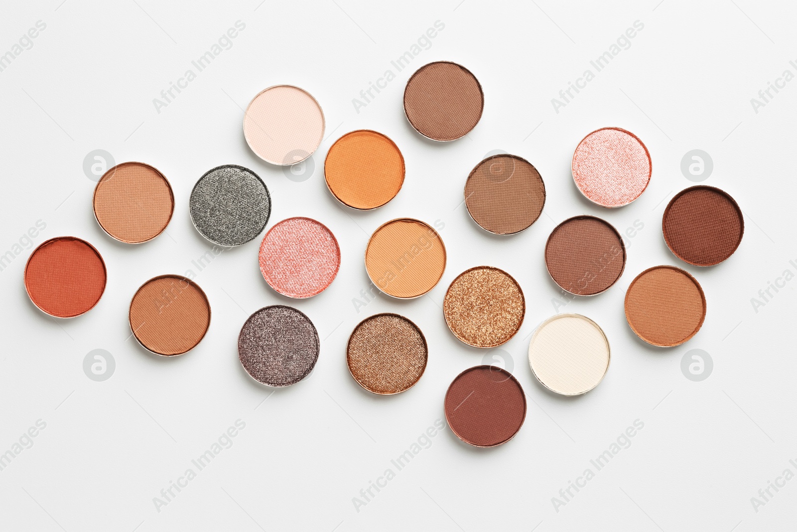Beautiful eyeshadow refill pans on white background, flat lay Photo of Beautiful eyeshadow refill pans on white background, flat lay