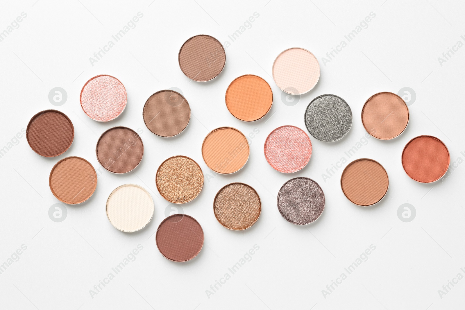Beautiful eyeshadow refill pans on white background, flat lay Photo of Beautiful eyeshadow refill pans on white background, flat lay