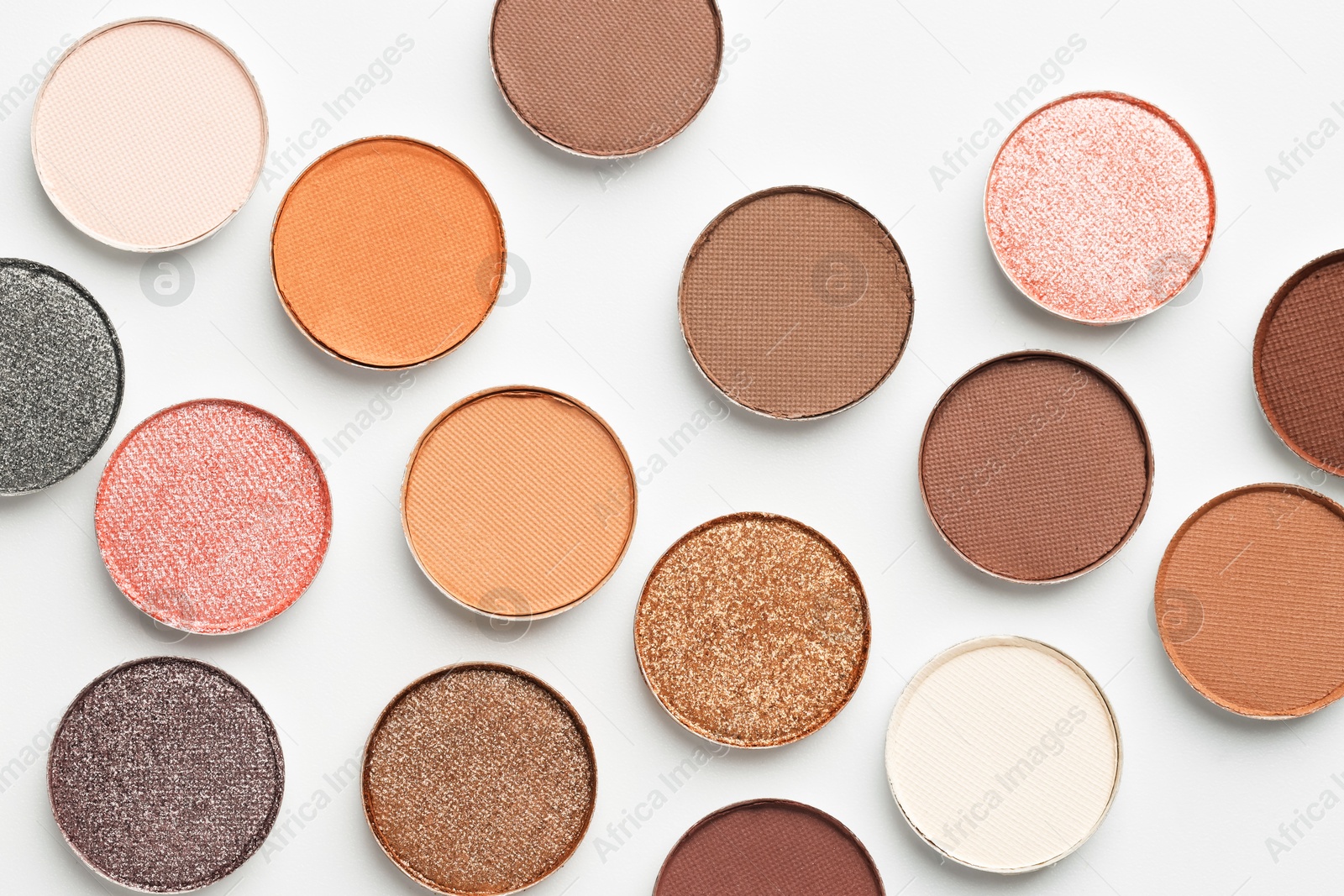 Beautiful eyeshadow refill pans on white background, flat lay Photo of Beautiful eyeshadow refill pans on white background, flat lay