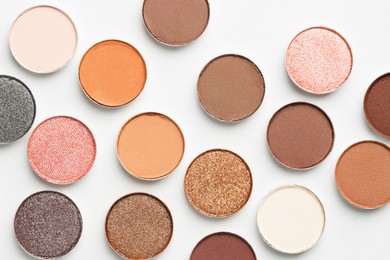 Photo of Beautiful eyeshadow refill pans on white background, flat lay