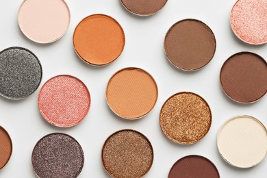 Photo of Beautiful eyeshadow refill pans on white background, flat lay