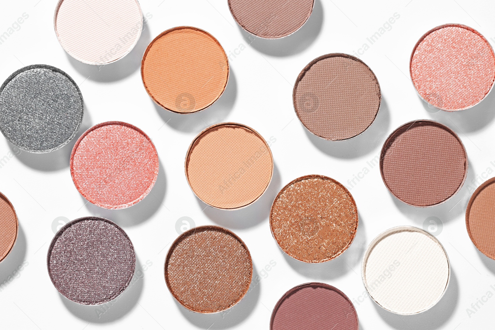 Beautiful eyeshadow refill pans on white background, flat lay Photo of Beautiful eyeshadow refill pans on white background, flat lay