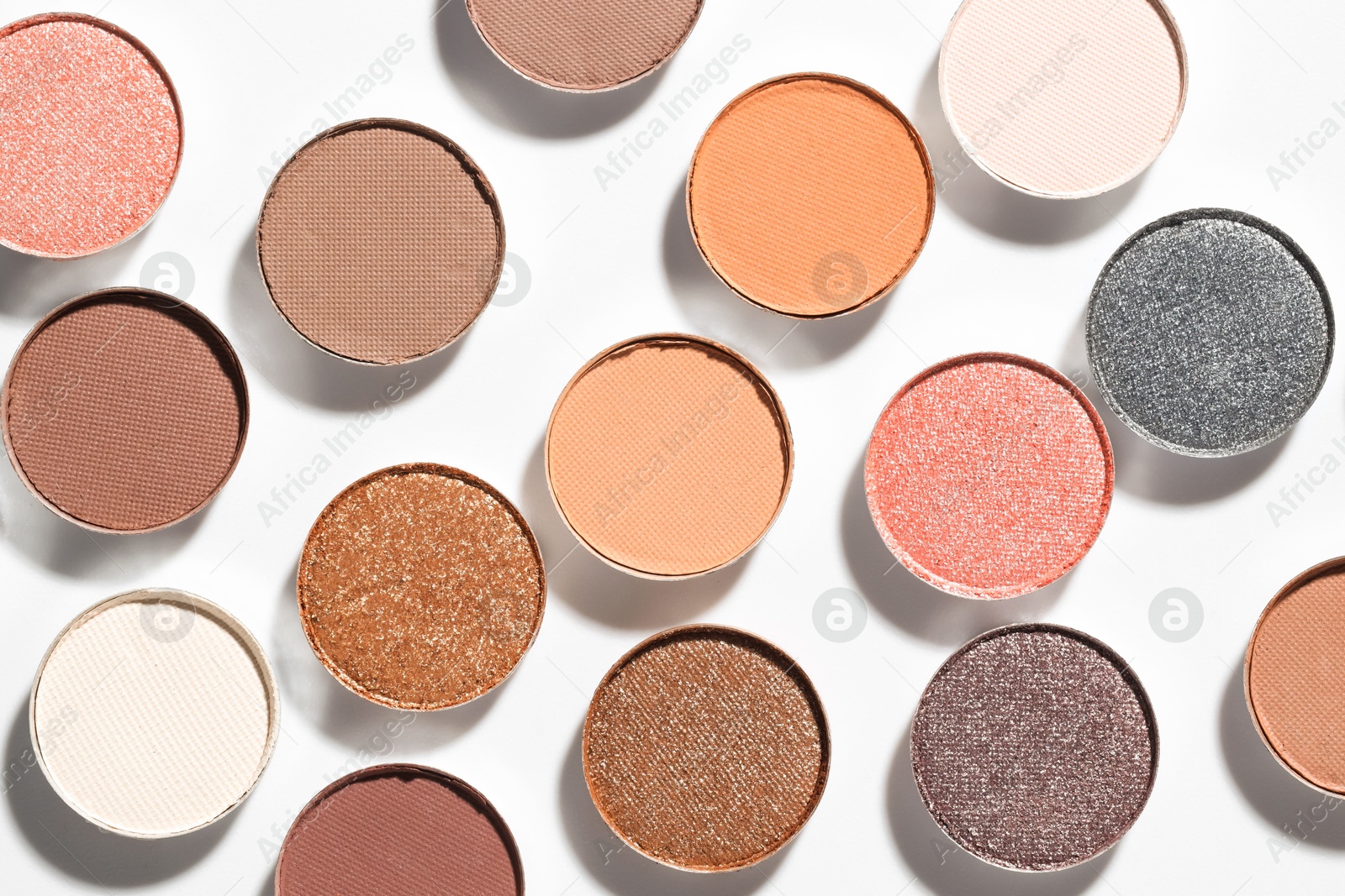 Beautiful eyeshadow refill pans on white background, flat lay Photo of Beautiful eyeshadow refill pans on white background, flat lay