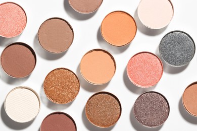 Photo of Beautiful eyeshadow refill pans on white background, flat lay