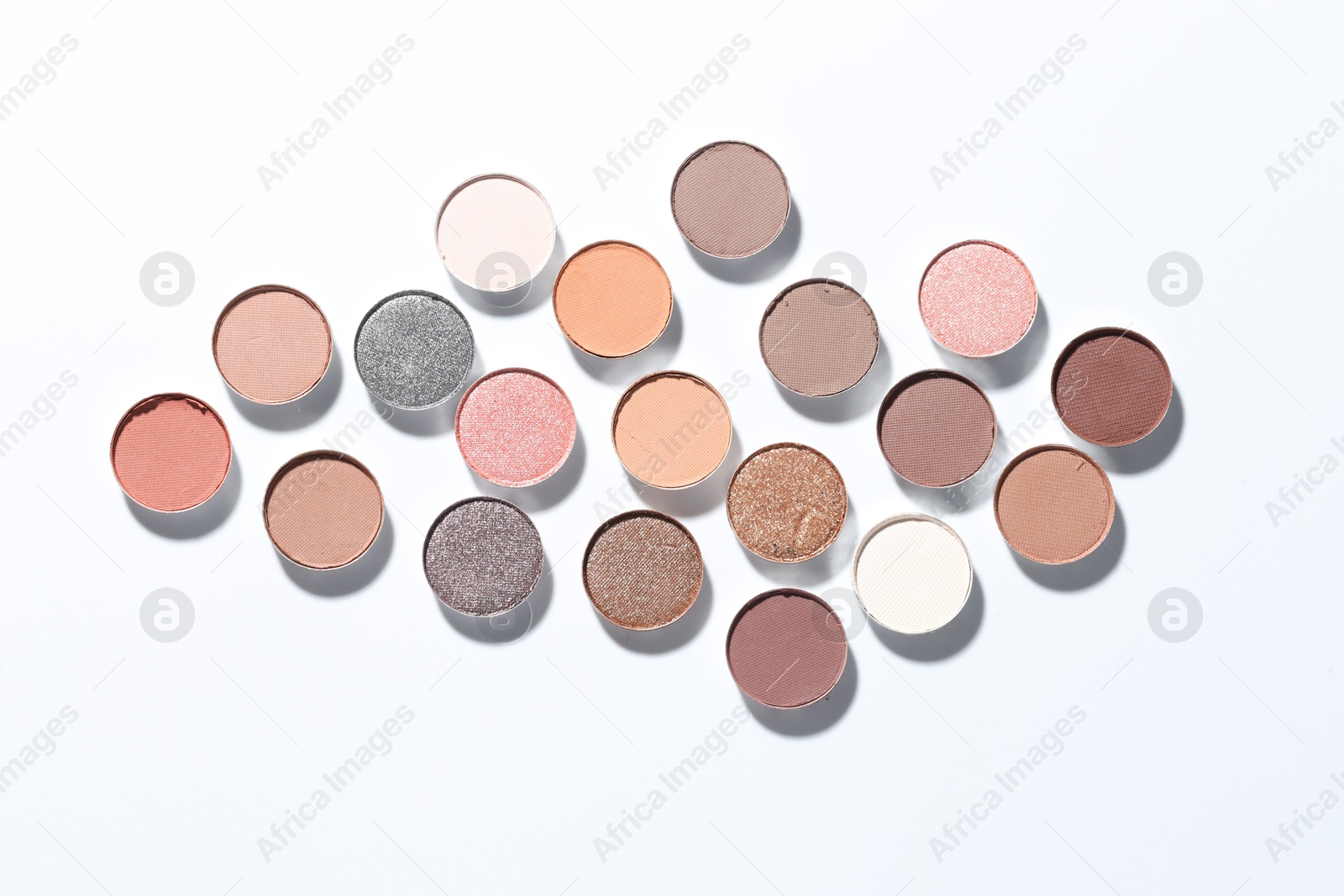 Beautiful eyeshadow refill pans on white background, flat lay Photo of Beautiful eyeshadow refill pans on white background, flat lay