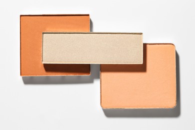 Photo of Beautiful eyeshadow refill pans on white background, flat lay